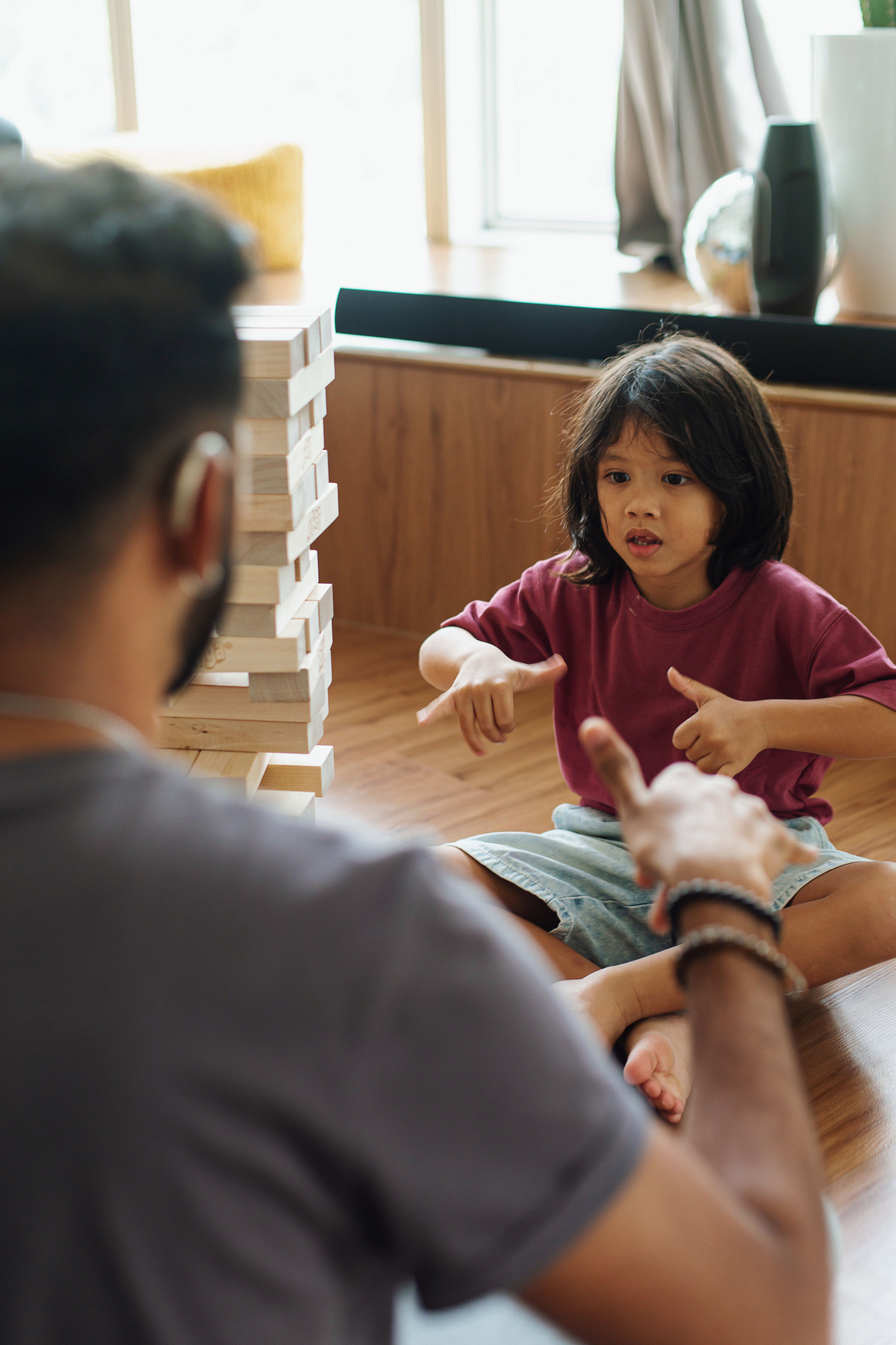 Father Doing Sign Language to Child at Home 