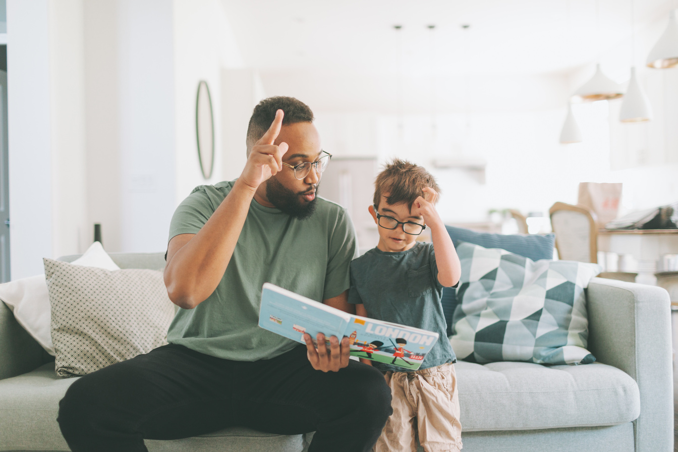 Teacher Teaching Boy Alphabets in Sign Language